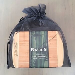 NWT Bamboo cutting board with Cadillac logo. Tan and brown color.